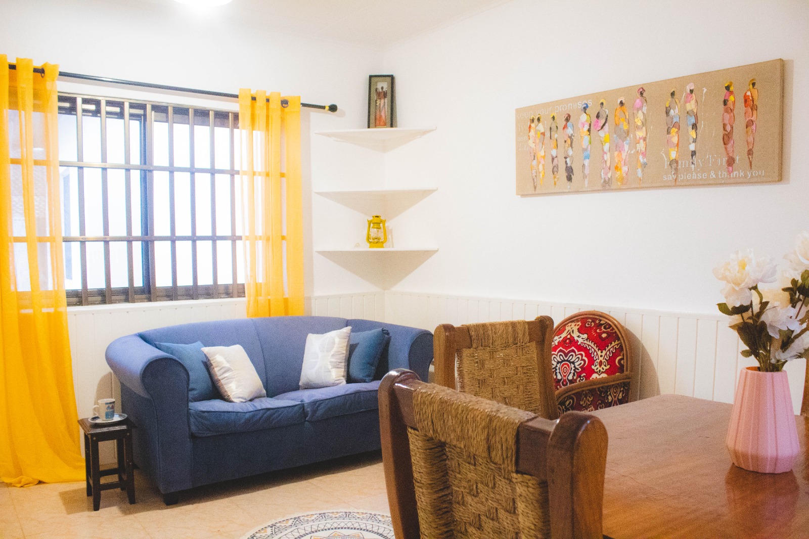 The living room has a comfortable seating area with a sofa-bed, perfect for entertaining overnight guests, as well as a small dining area.