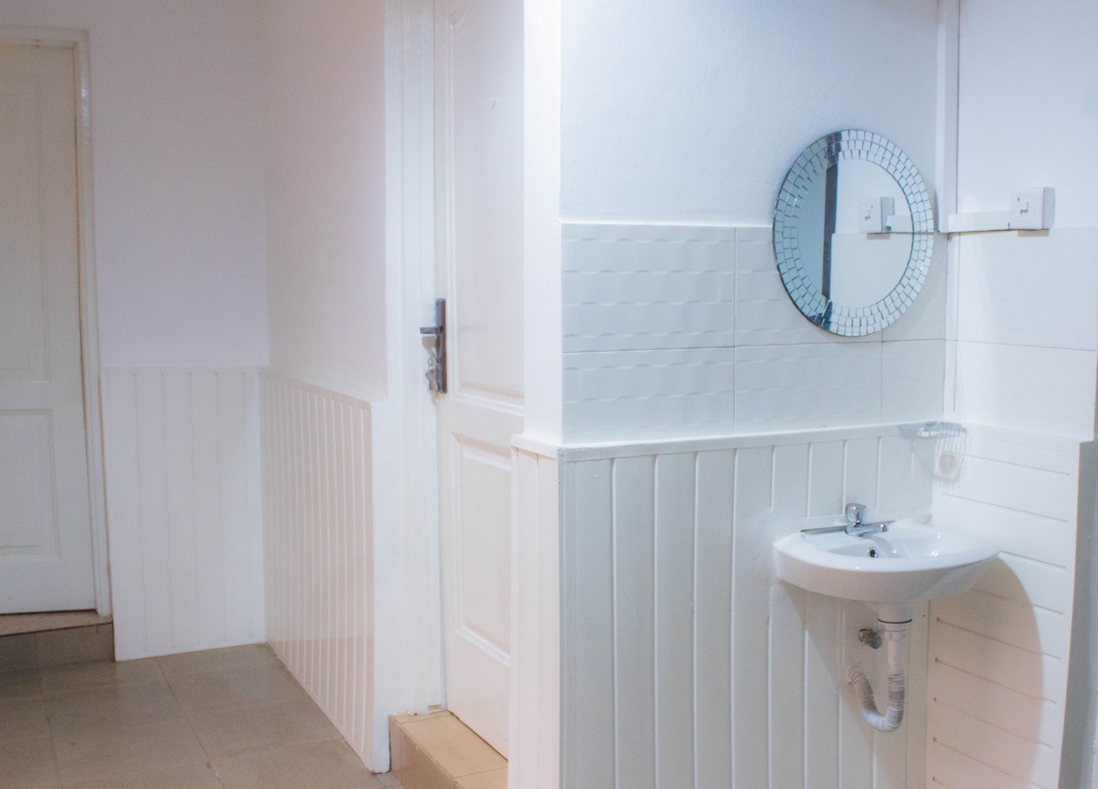 The bathroom area has a minimalist look and feel, complete with a shower room and WC.
